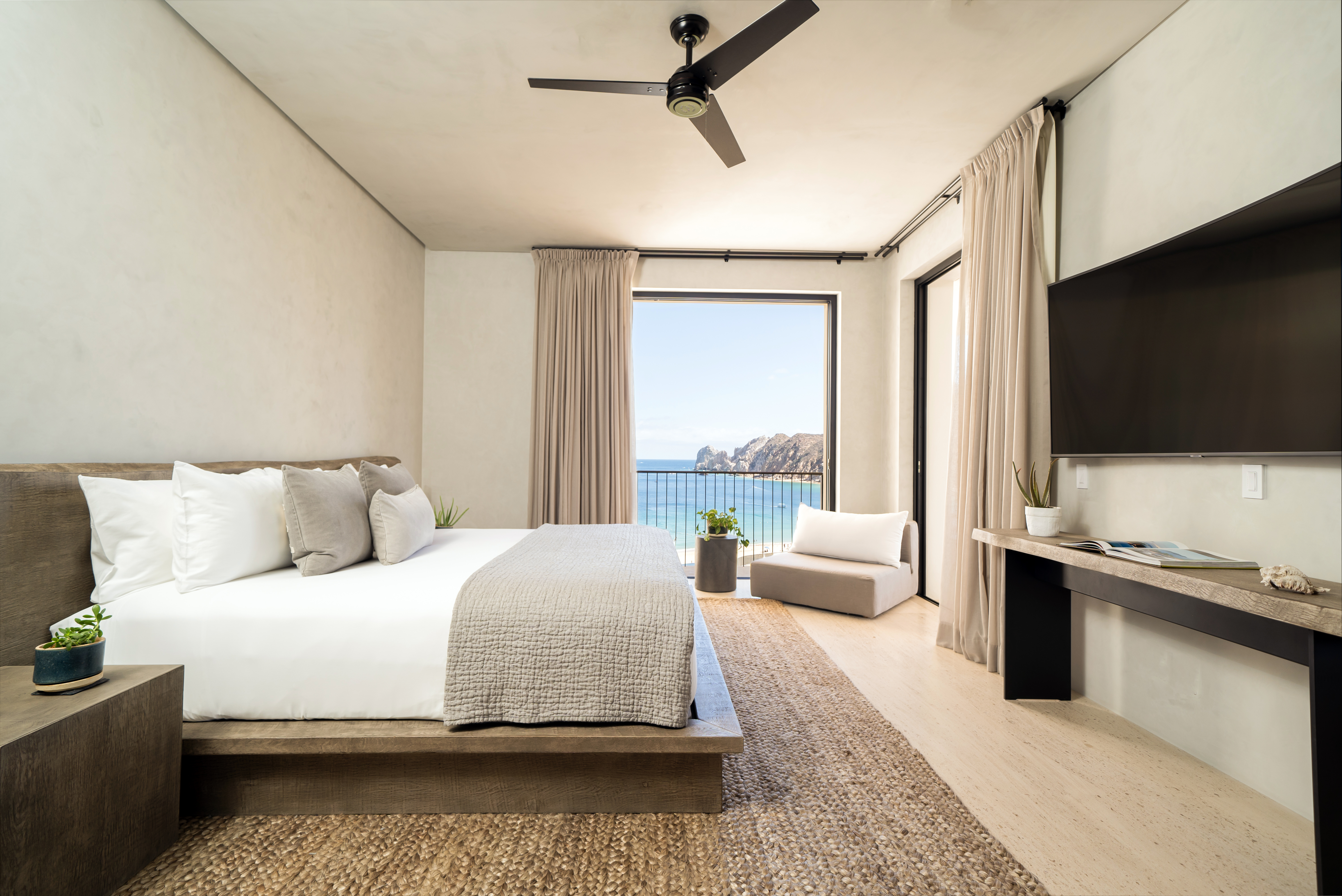 Made bed across from a tv 