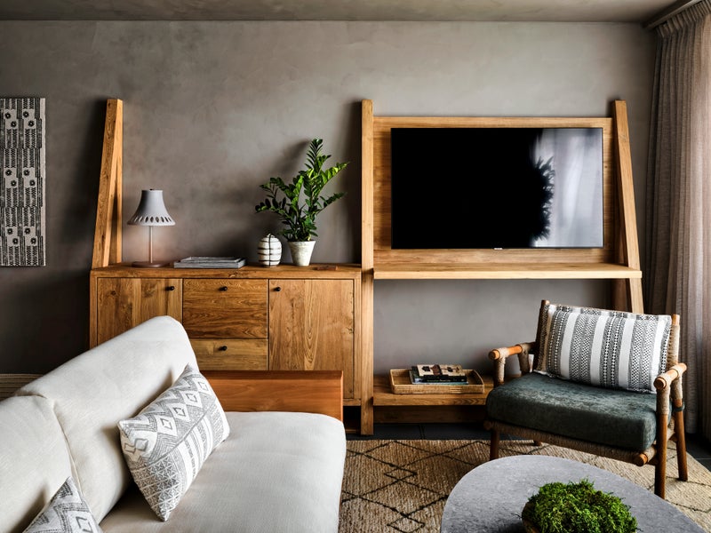 wall with tv and storage space