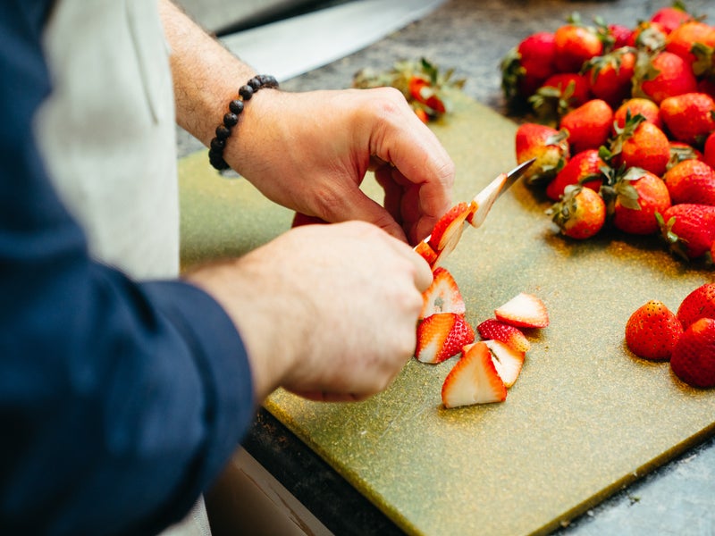 Chef cutting strawberries 