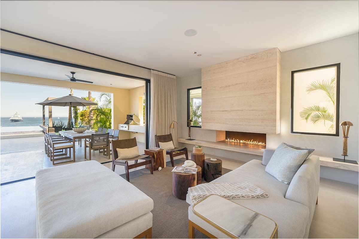 A living room with couches and a fireplace