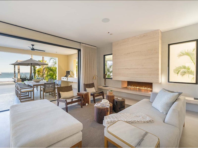 A living room with couches and a fireplace