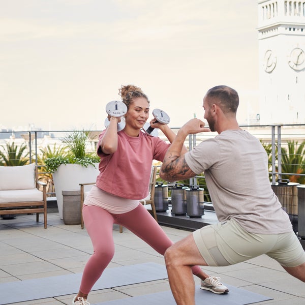 People working out at the 1 Hotel San Francisco rooftop