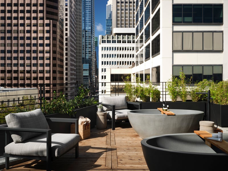 Rooftop spa terrace with stone tubs