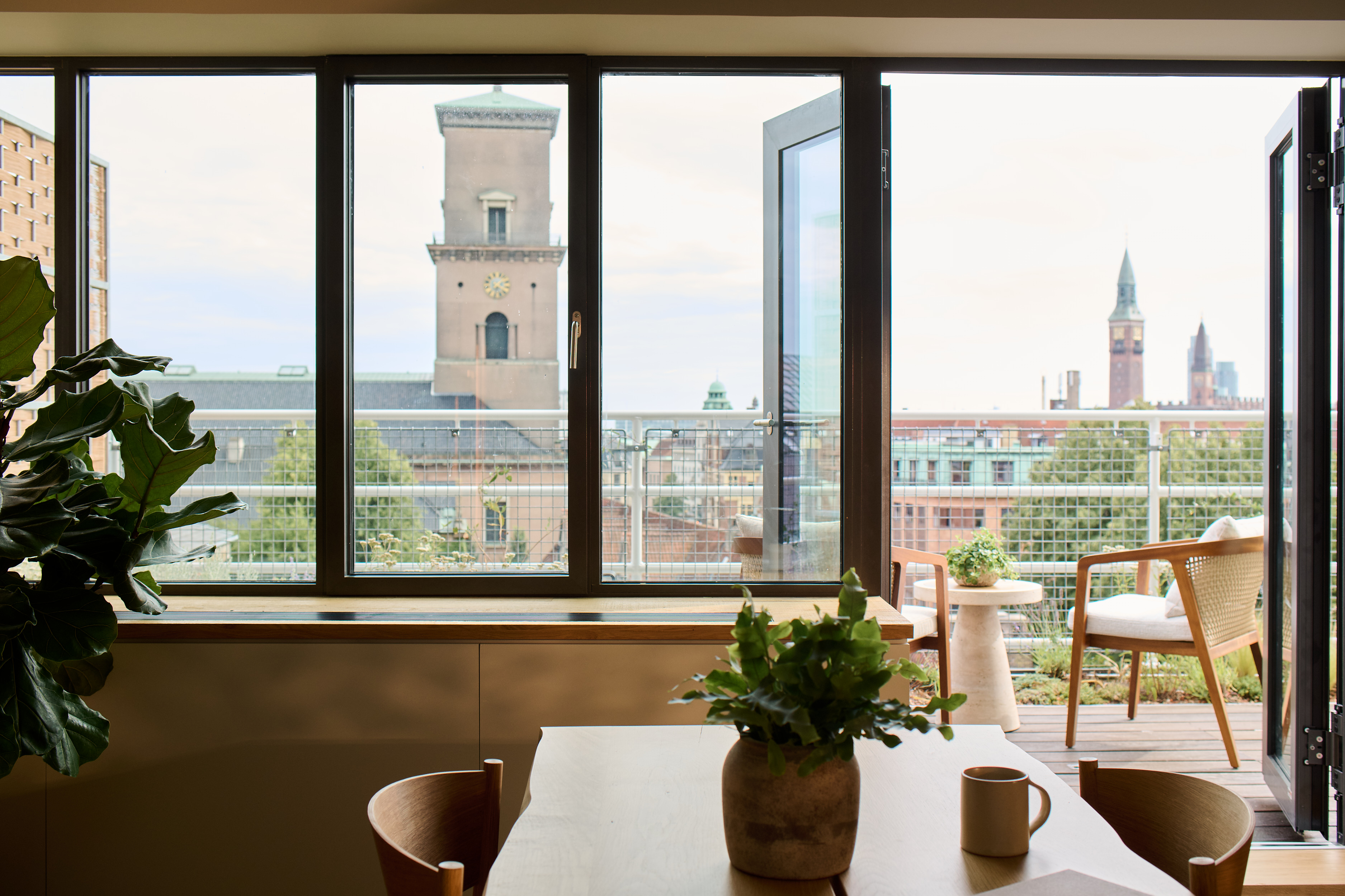 A private terrace of 1 Hotel Copenhagane suite overlooking the city