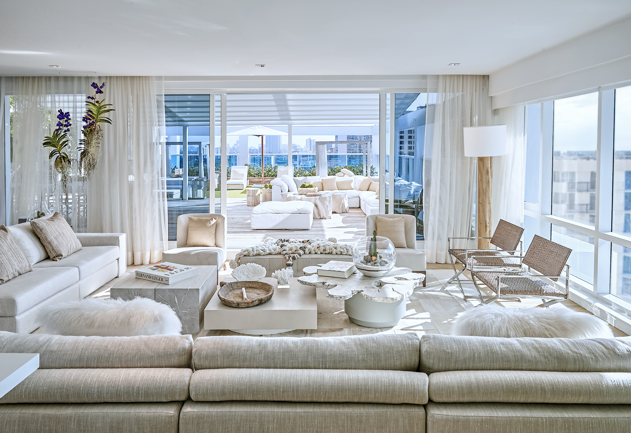 Living room area with a sectional couch and coffee tables