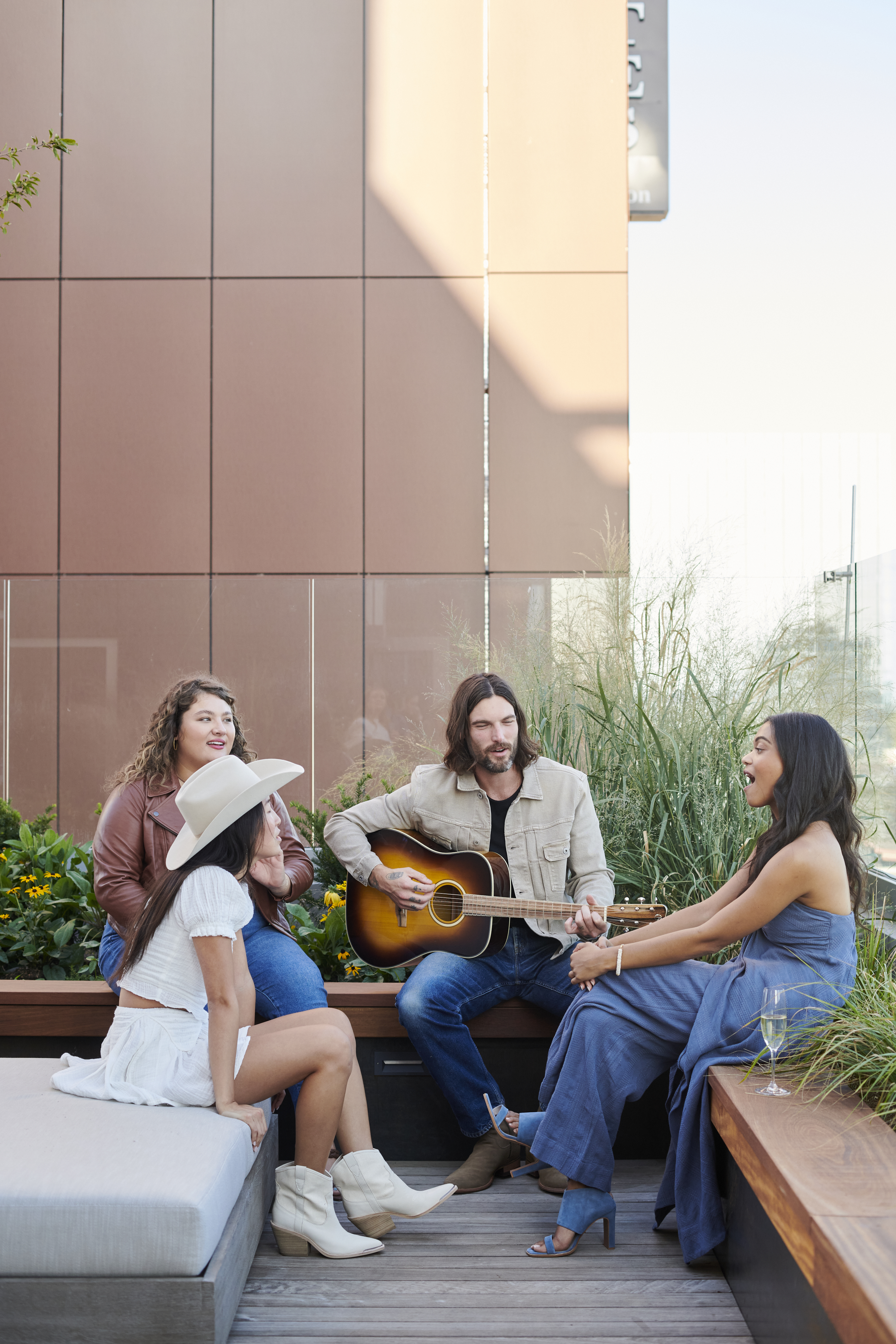 Group of friends sitting on the terrace 