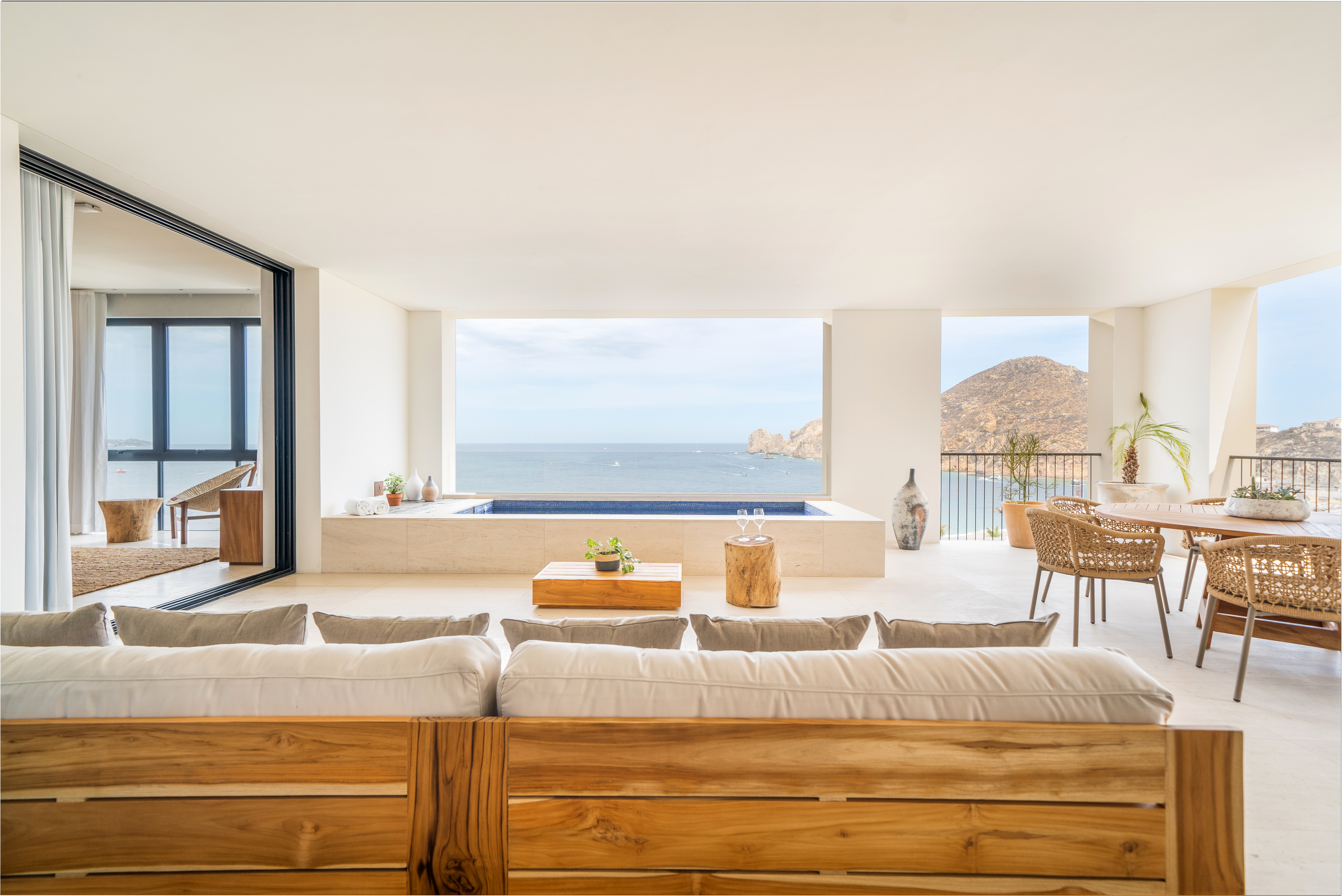 Bright seating area with an indoor pool