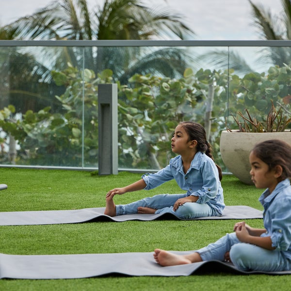 Children doing yoga outside
