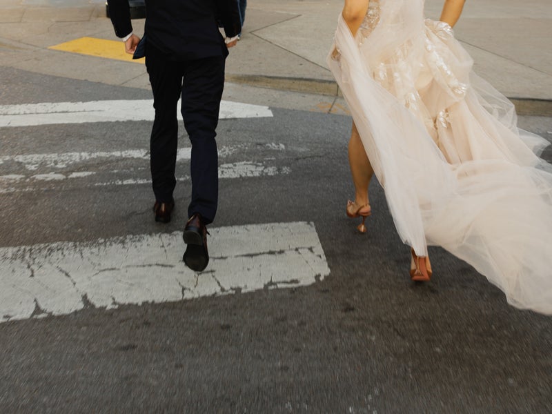 Bride and groom on cross walk