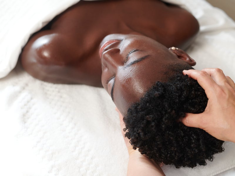 Woman getting a head massage