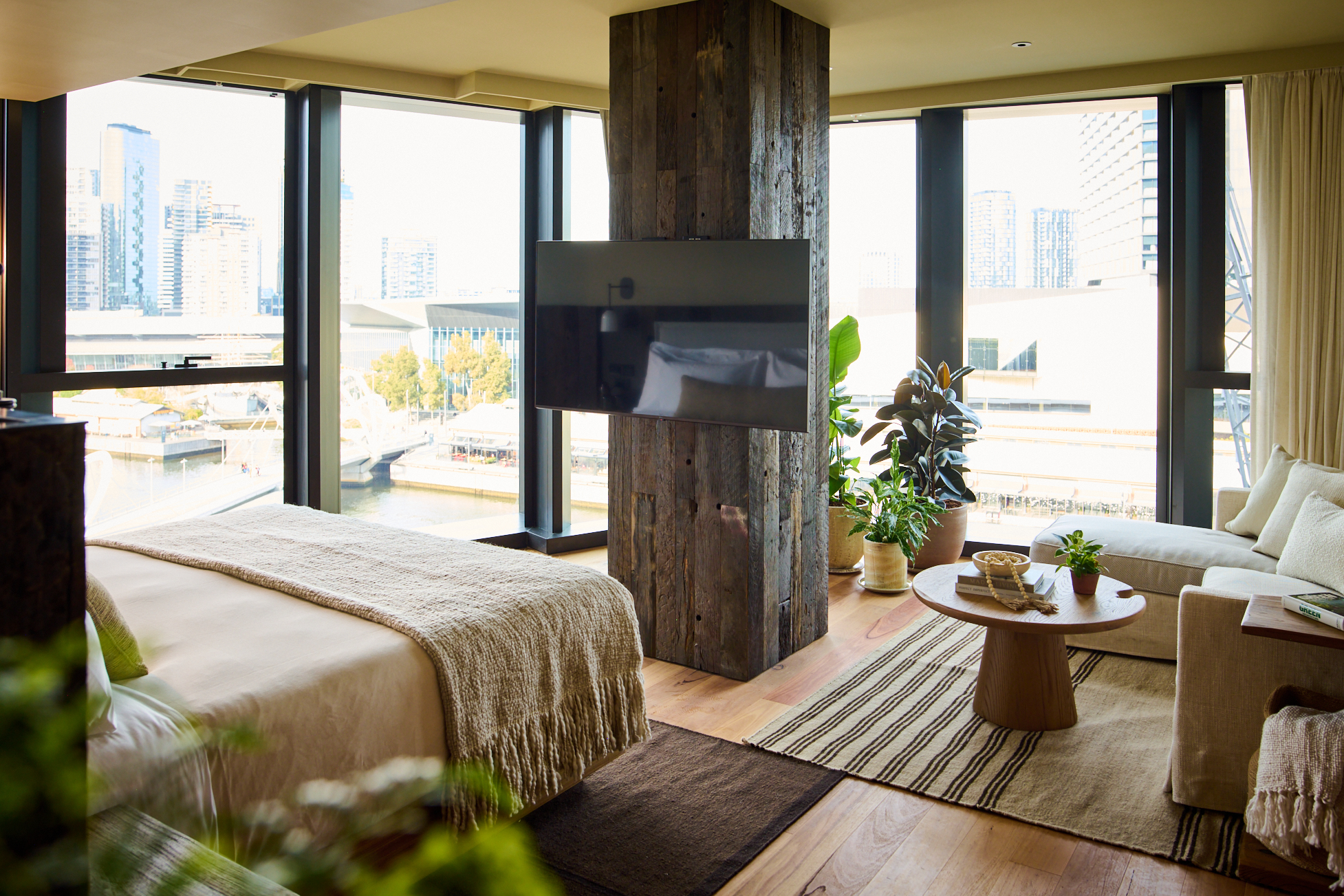 Sustainable Bedroom with plants, couch, a tea table, a tv