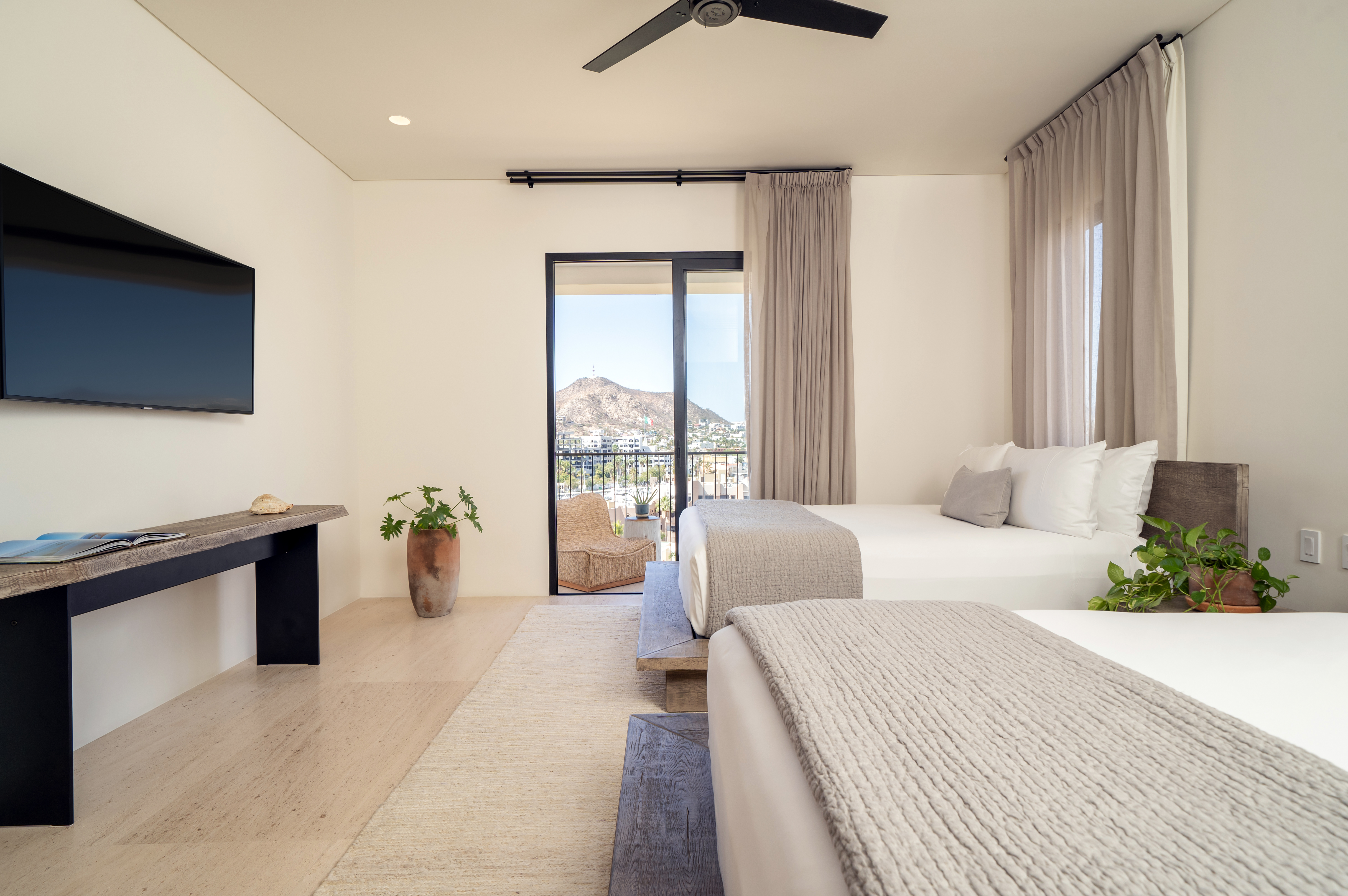 White bedroom with two beds