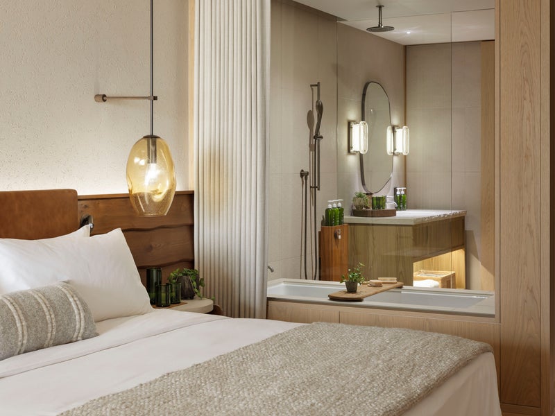 Modern bedroom and bathroom with glass