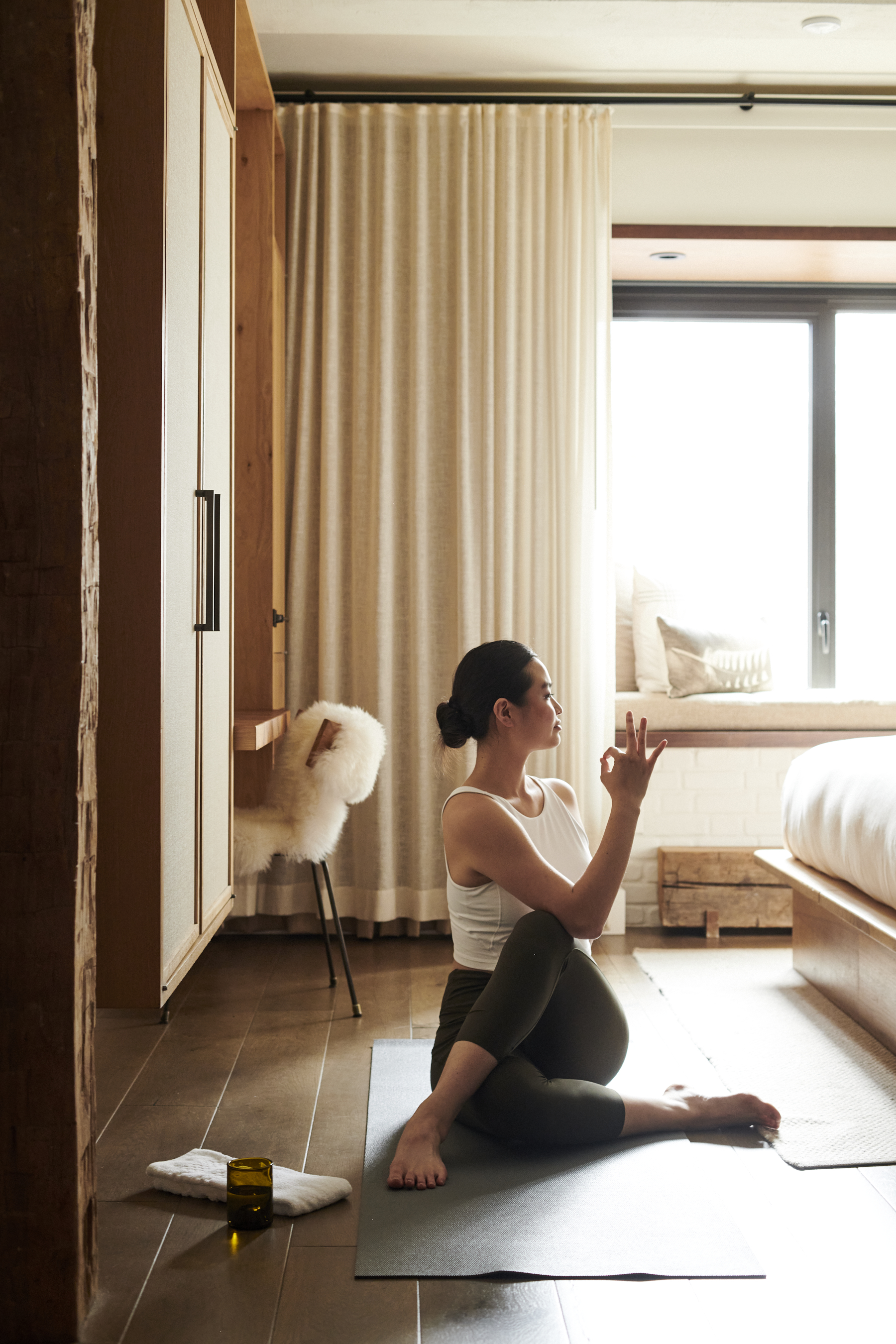 Woman doing yoga in her room 