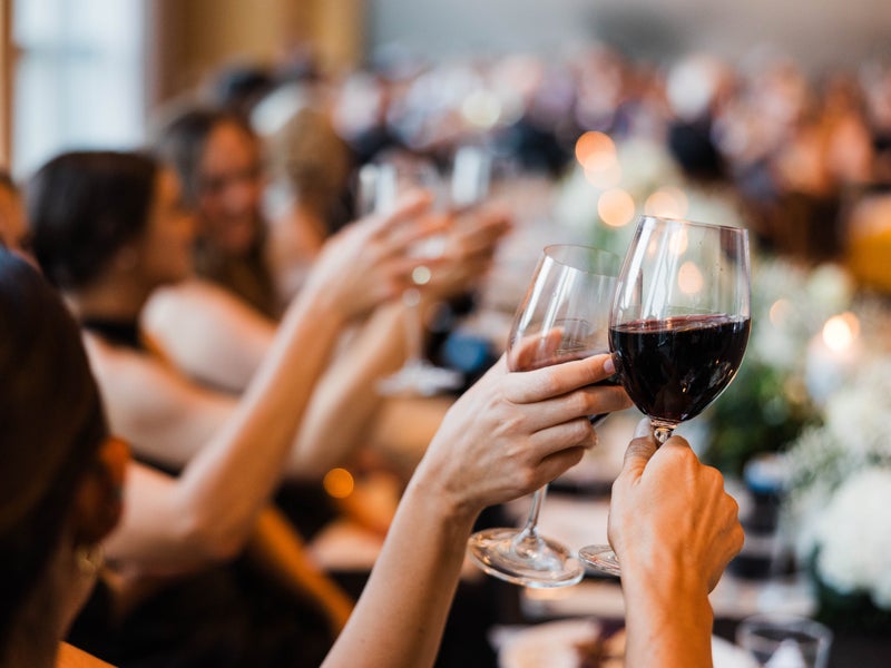 wedding guest toasting to the bride and groom