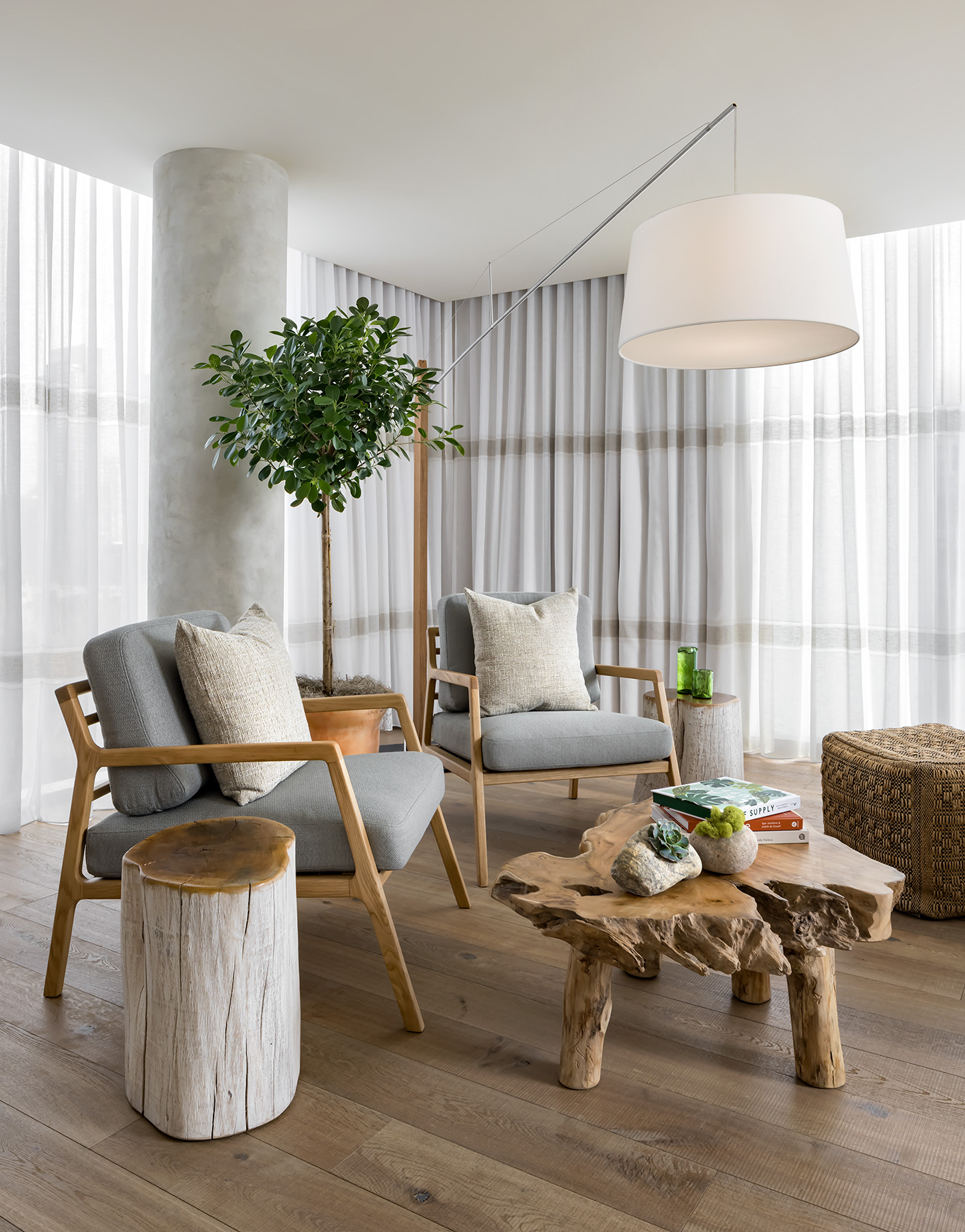 Bright living room with chairs and a live edge coffee table