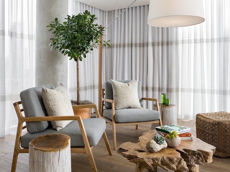 Bright living room with chairs and a live edge coffee table