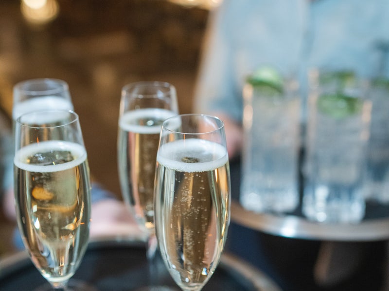 Server holding a tray of champagne