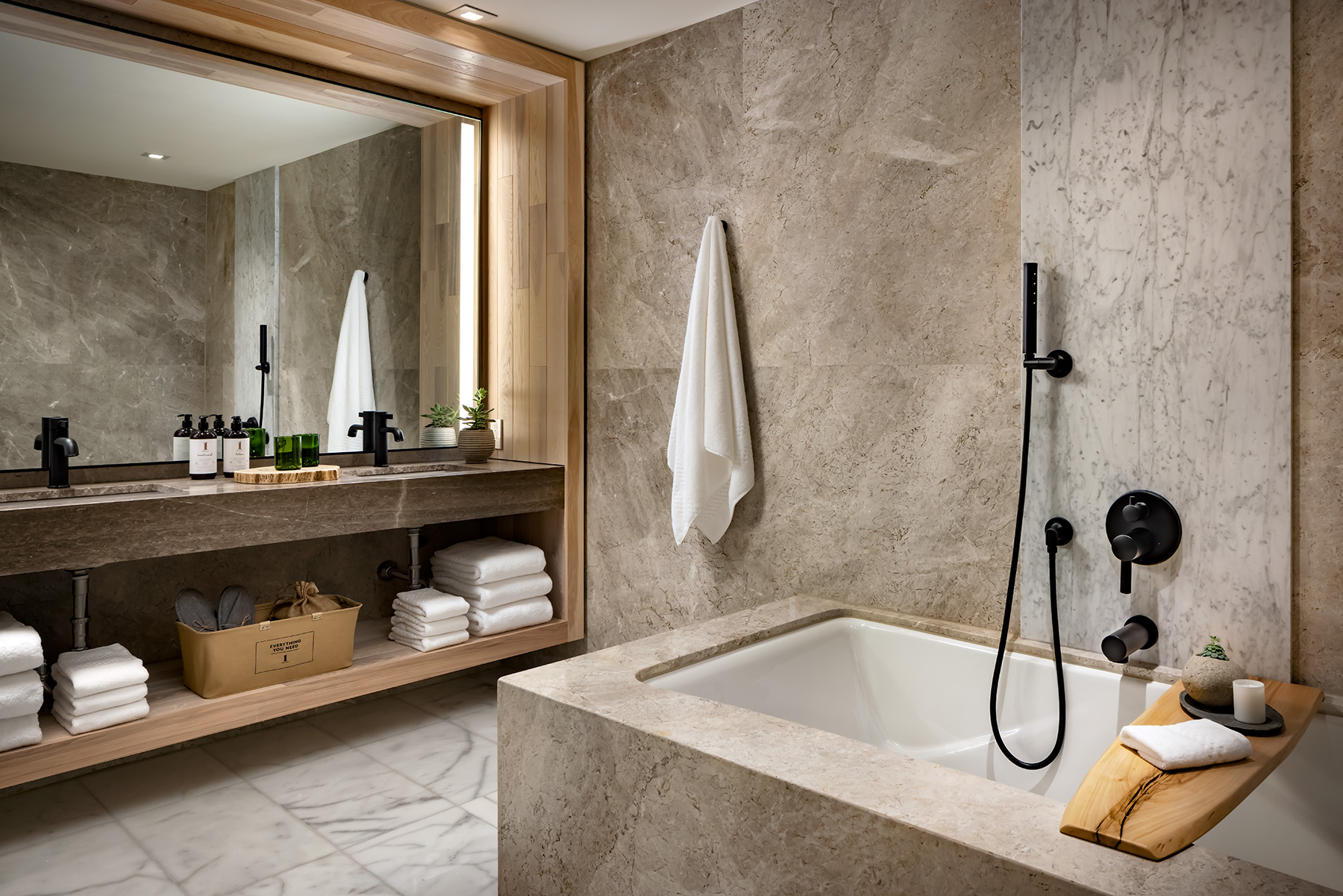 Rock slate bathroom with bathtub and double sinks