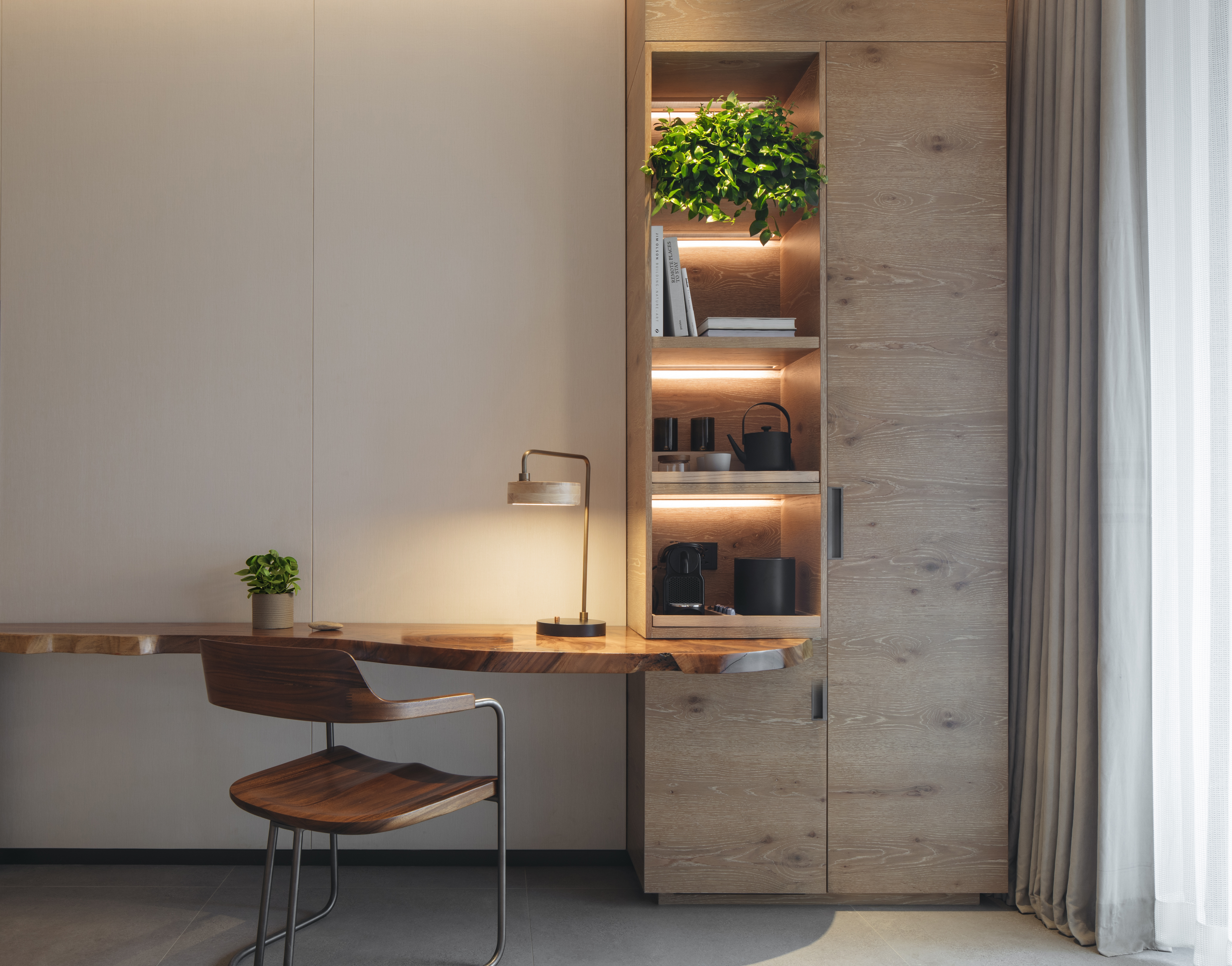 Botanic Pool view room with a desk, chair, and reading light