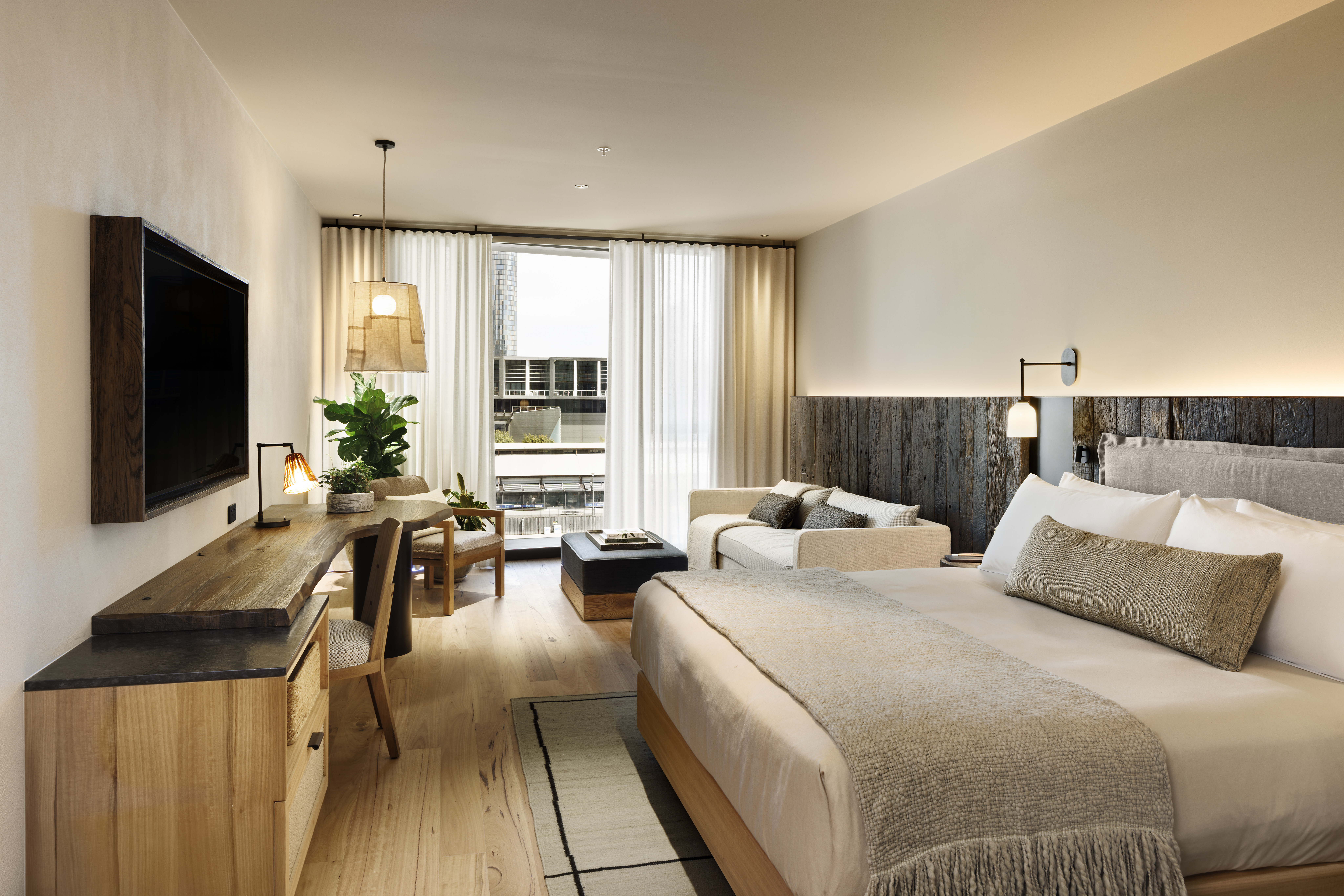 Bedroom with seating area and desk