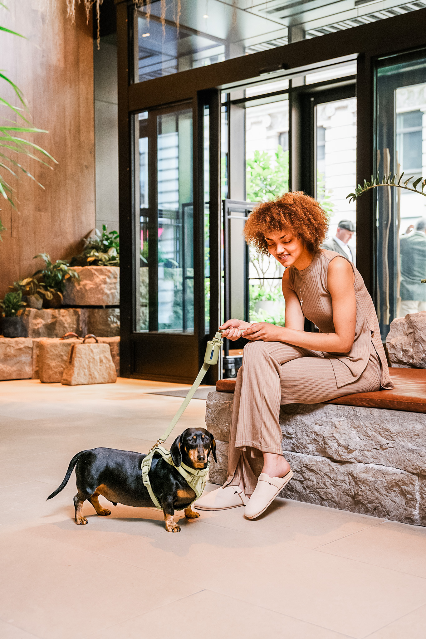 Woman sitting near her dog