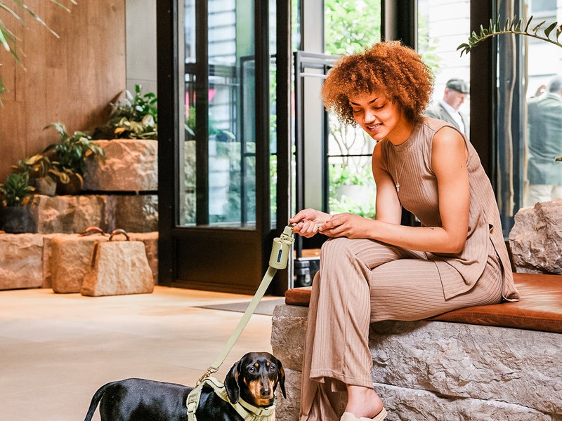 Woman sitting near her dog