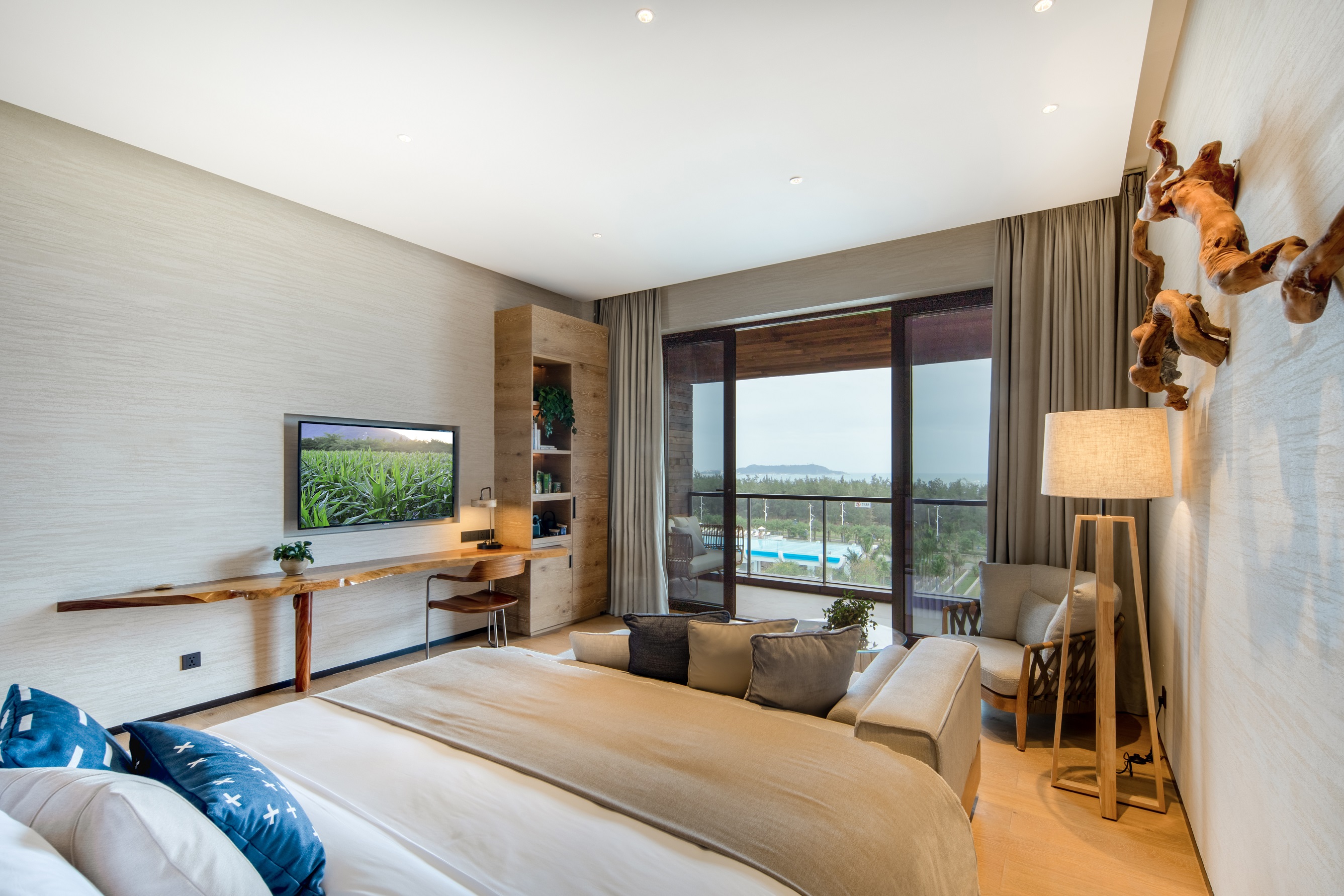 Views of the patio and beyond as situated from the rooms king size bed