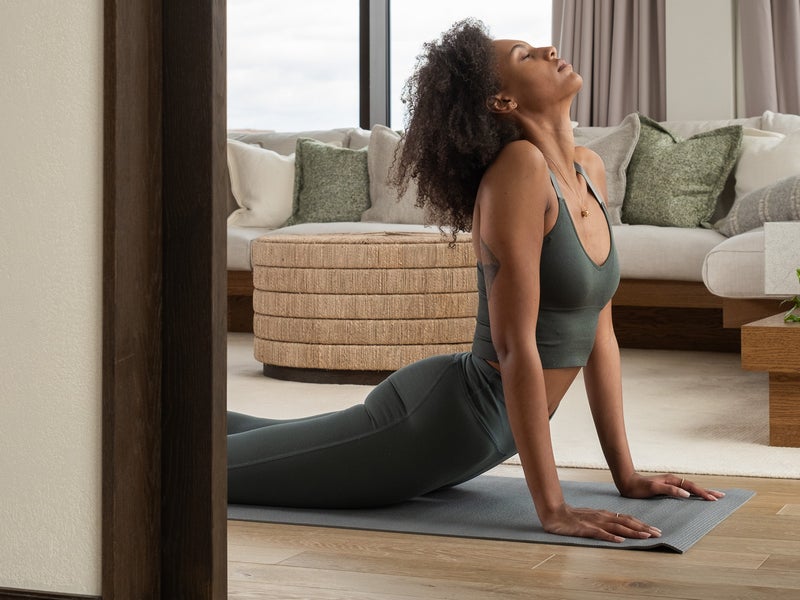 Women holding the upward dog yoga position