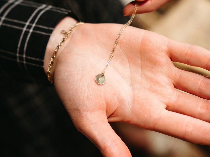 a person holding jewelry
