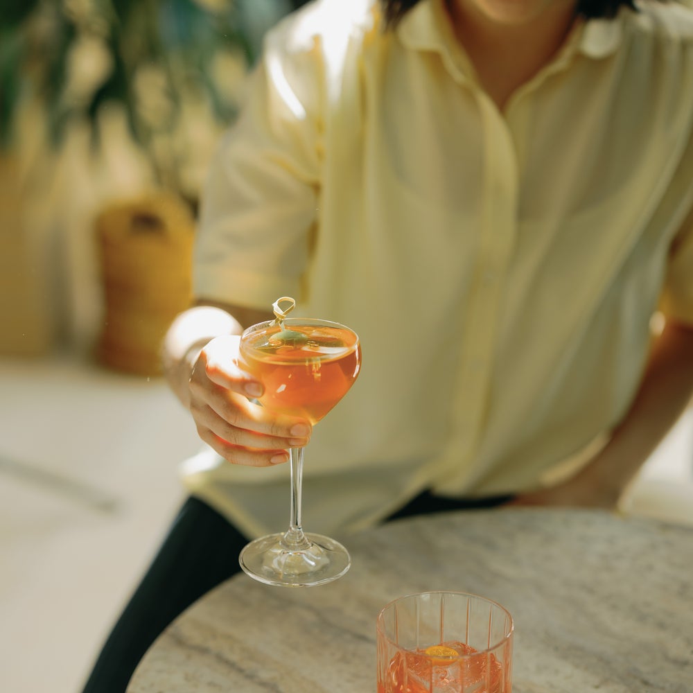 girl drinking a cocktail