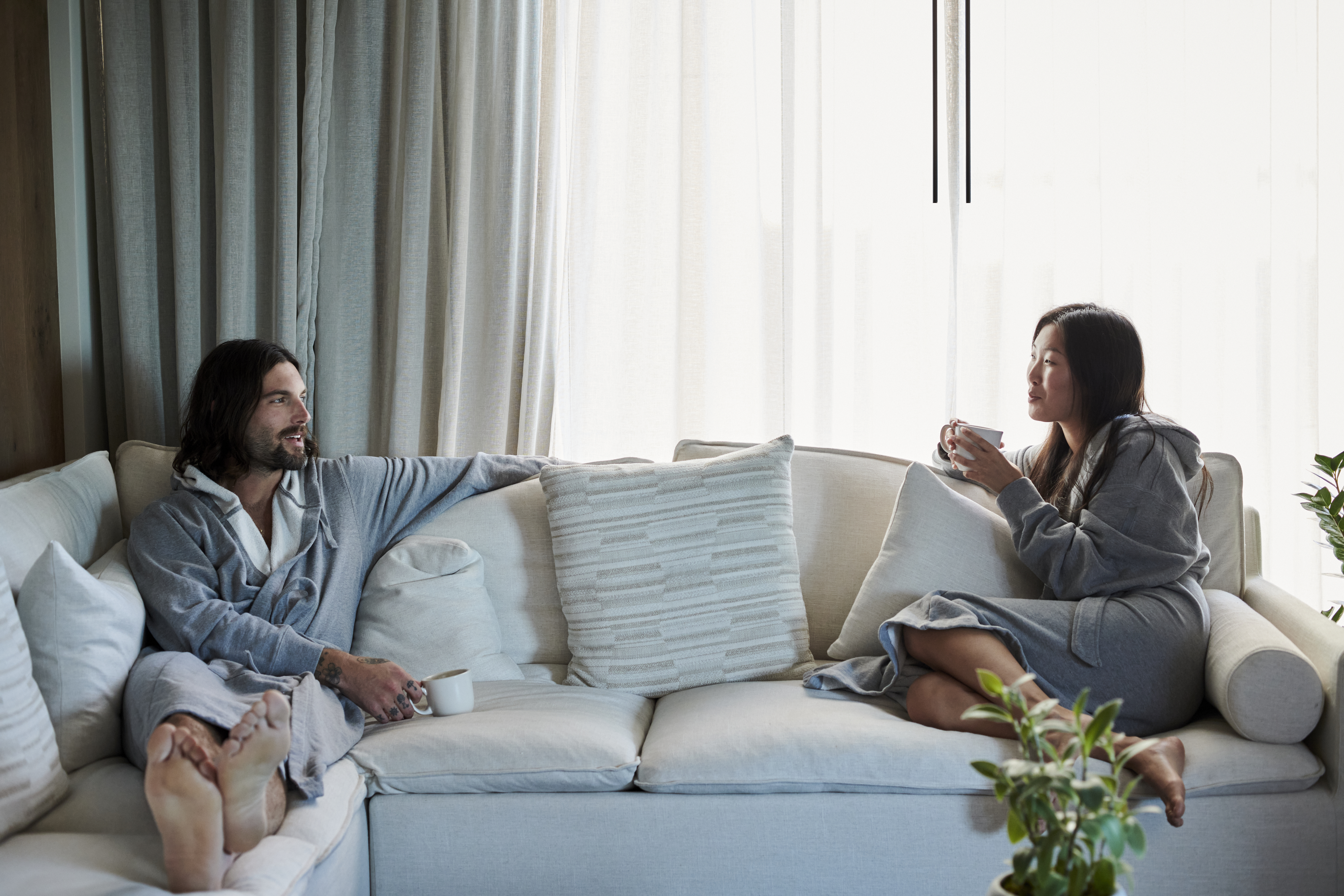 Couple on the couch in robes
