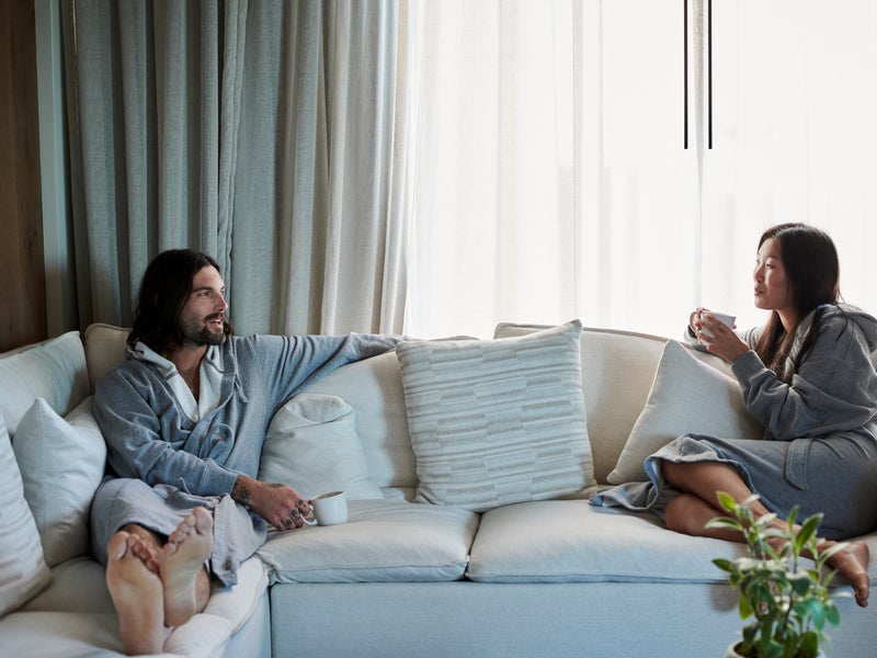 Couple on the couch in robes