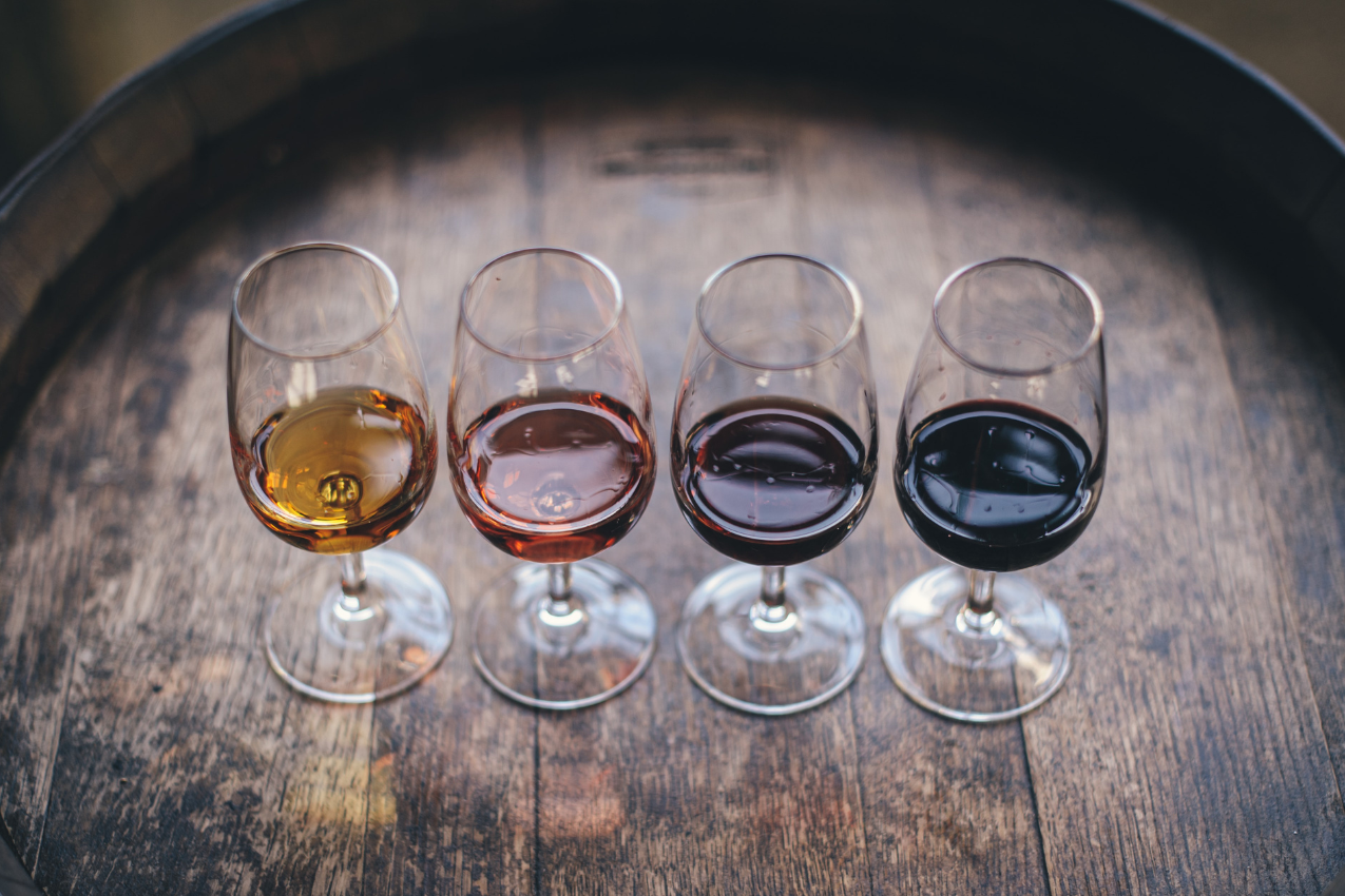 Four glasses lined up in a row