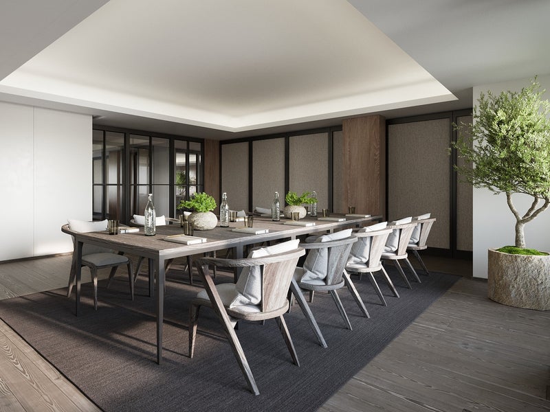 Grey toned meeting area with a long table