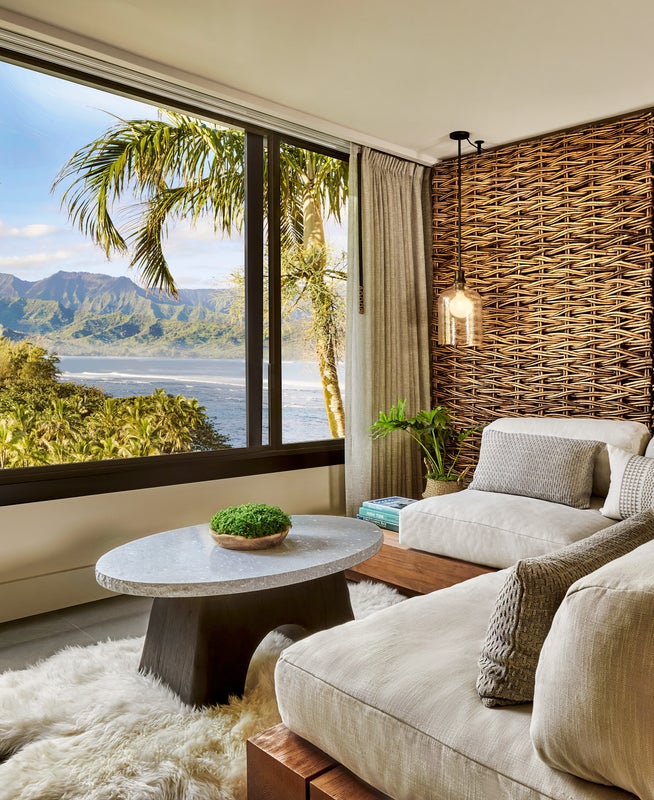 a room with large windows and a beach-view