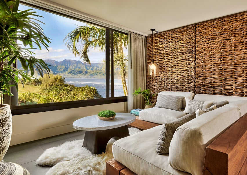 a room with large windows and a beach-view
