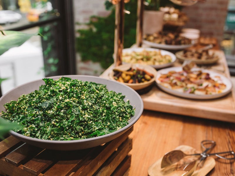 table filled with large serving platers of food