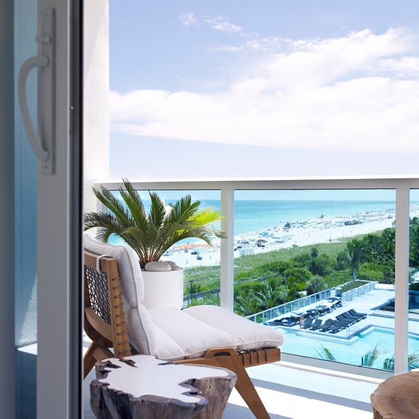 Ocean View Jr Suite King Bed With Balcony overlooking the water and beachfront
