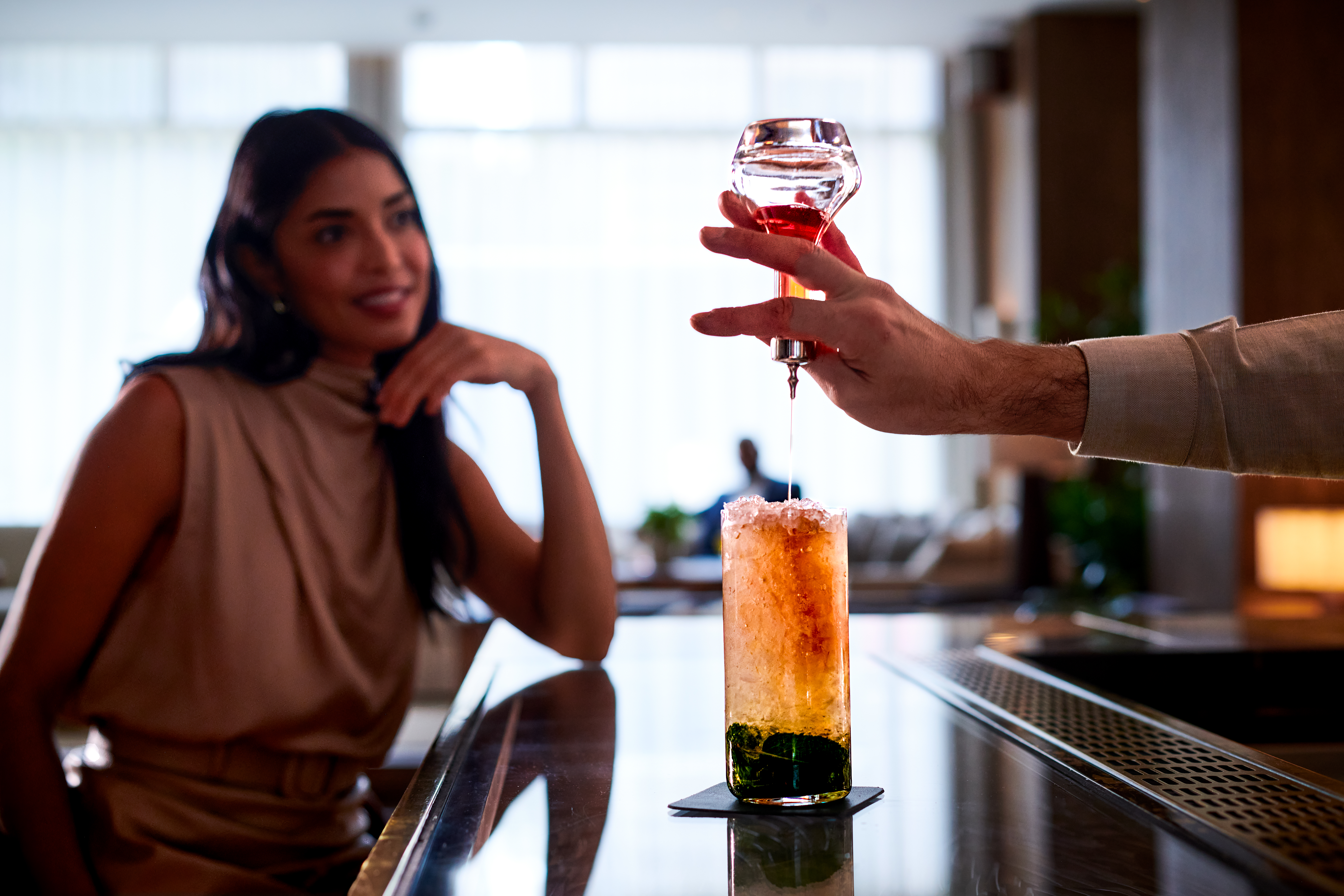 Cocktail being served at the bar