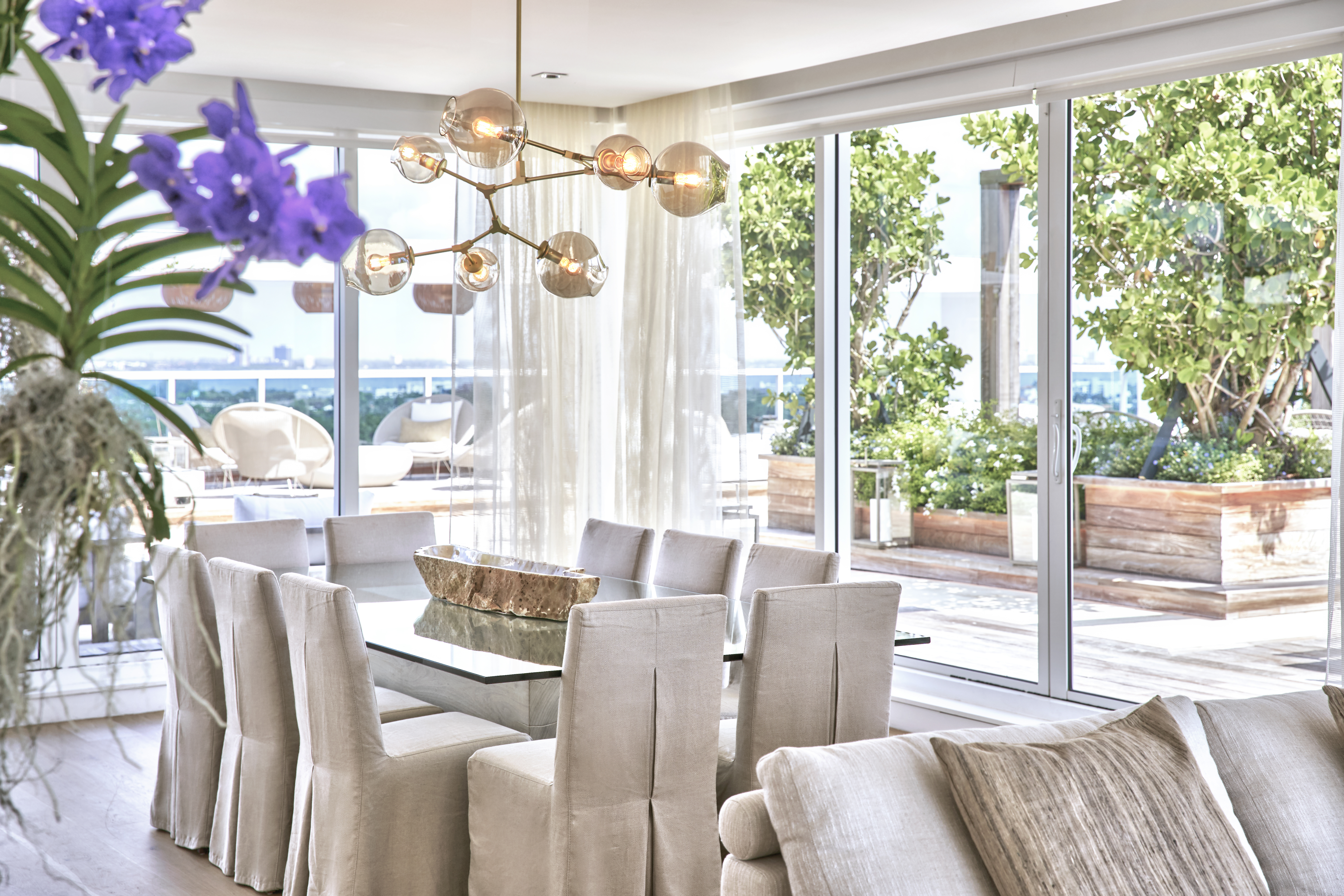 Dining table with an eccentric light fixture