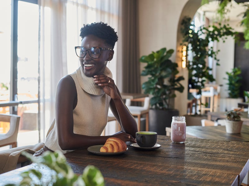 Woman having a coffee at Terrene