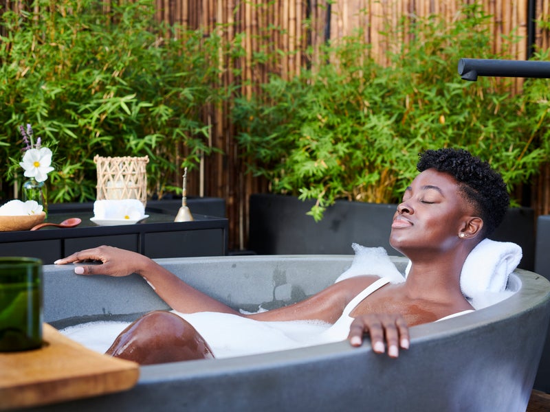 Woman relaxing in a tub