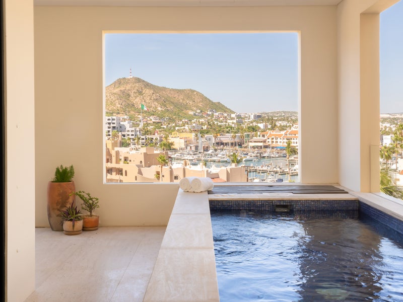 Personal pool on a patio overlooking a city