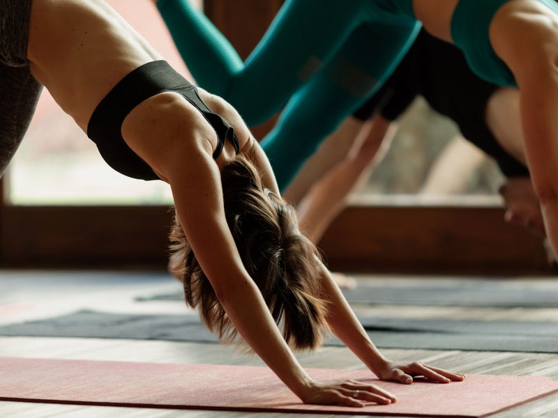 Three people doing yoga