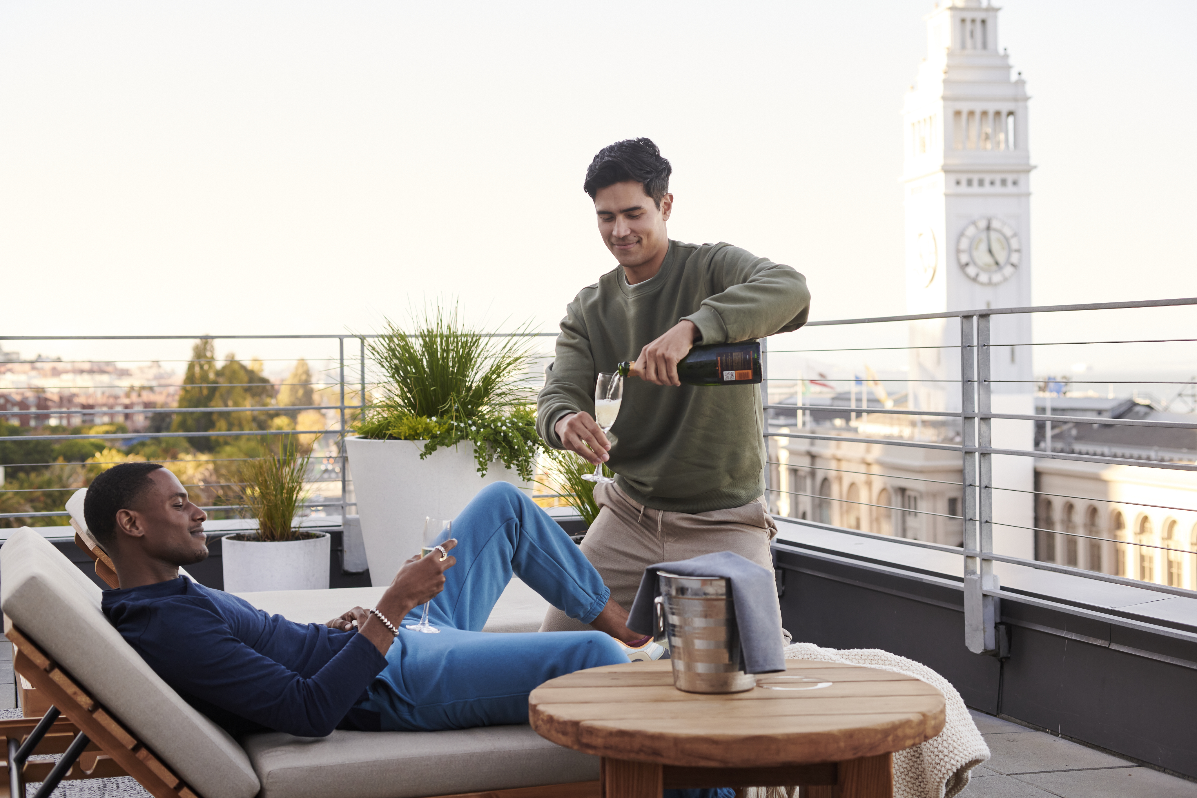 two people drinking champagne on a patio
