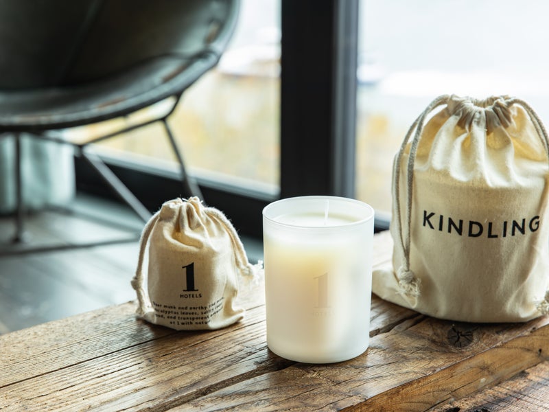 A wooden table with white candles