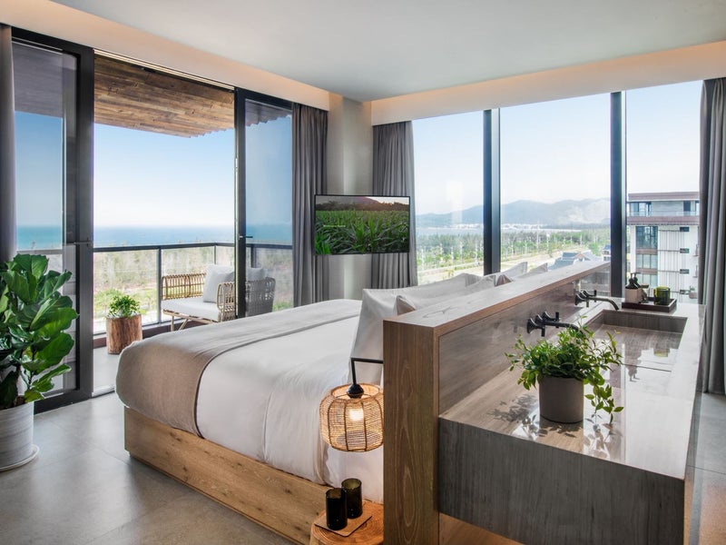 A bed with double sinks on the back