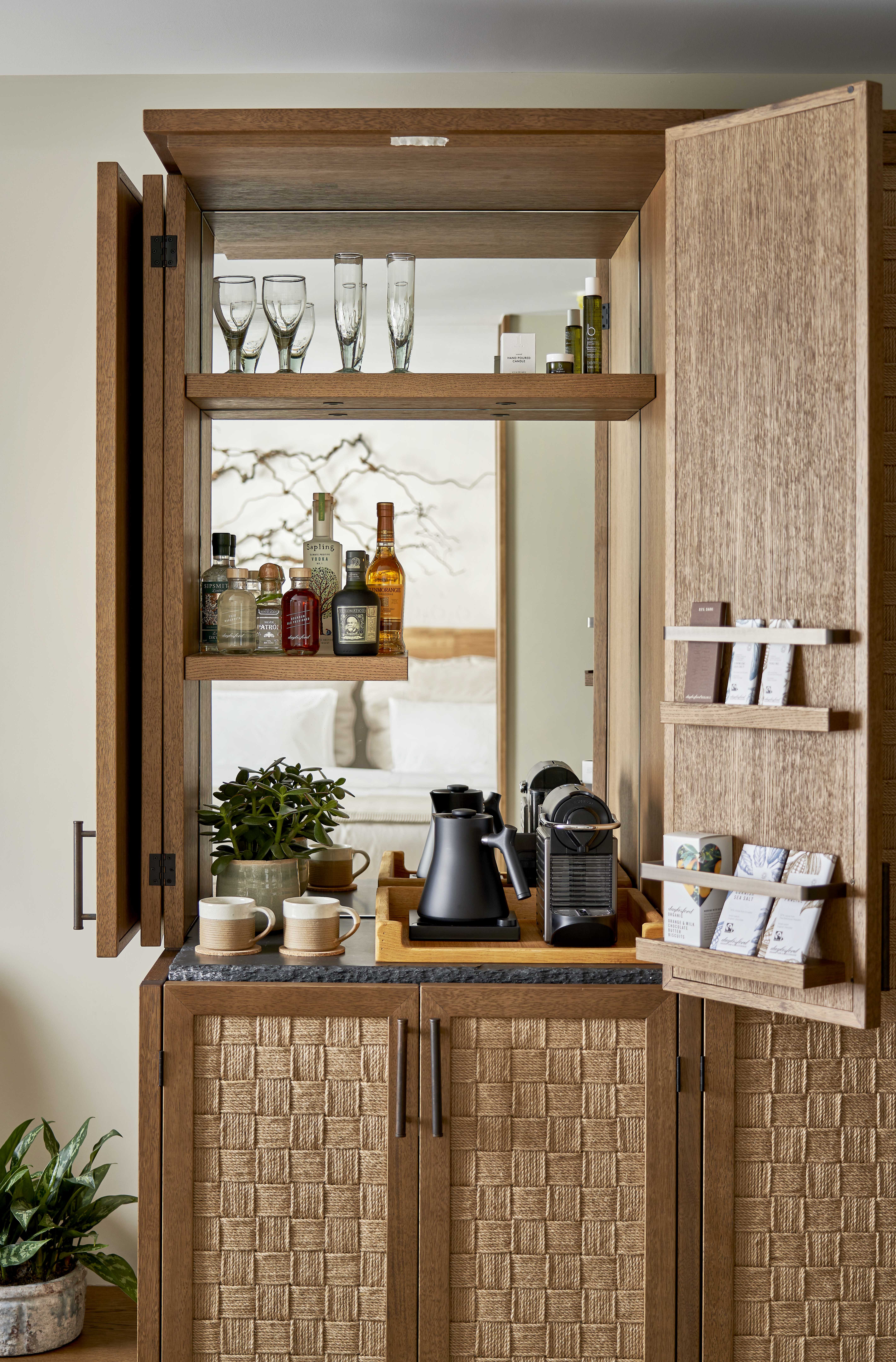 A 1Hotel mini bar featuring coffees and liquors.