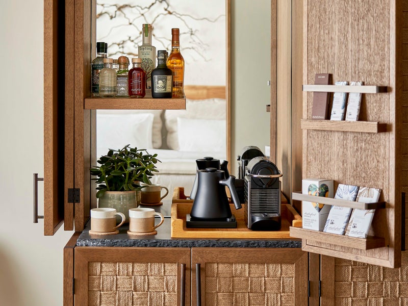 A 1Hotel mini bar featuring coffees and liquors.